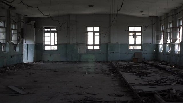 Old gloomy abandoned building of a plant or factory. Scary place, horrors, backdrop for nightmares