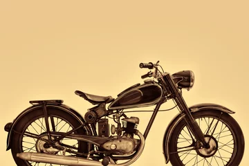 Poster Sepia toned side view image of a vintage motorcycle © Martin Bergsma