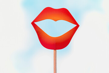 close up view of a red paper lips photo booth props