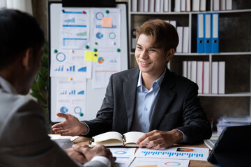 Sharing opinions. Group of young modern people in smart casual wear discussing business while working in the creative office