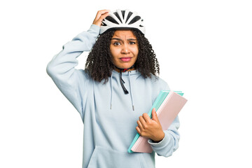 Young african american student woman wearing a helmet bike isolated being shocked, she has remembered important meeting.