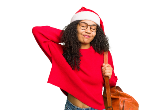 Young african american student woman wearing a christmas hat isolated touching back of head, thinking and making a choice.