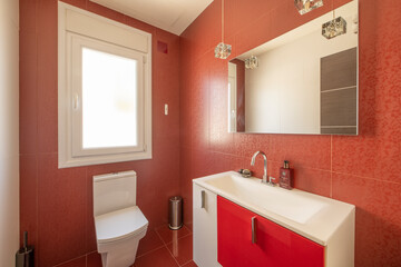 Fototapeta na wymiar Bathroom with square frameless mirror, wooden chest of drawers and red tiled walls
