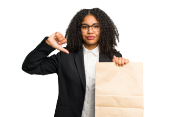 Young african american business woman holding a take away bag isolated showing a dislike gesture, thumbs down. Disagreement concept.