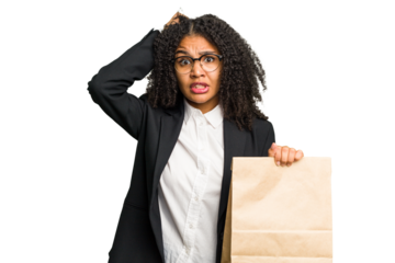 Young african american business woman holding a take away bag isolated being shocked, she has remembered important meeting.