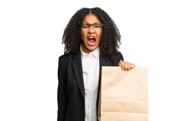 Young african american business woman holding a take away bag isolated screaming very angry and aggressive.
