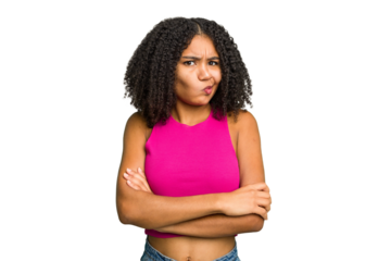 Young african american woman isolated frowning face in displeasure, keeps arms folded.