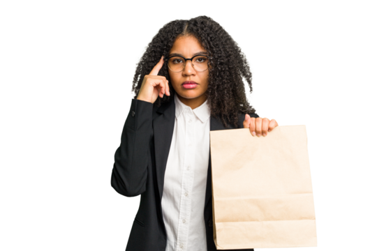 Young african american business woman holding a take away bag isolated pointing temple with finger, thinking, focused on a task.