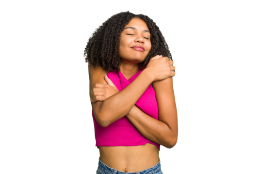 Young african american woman isolated hugs, smiling carefree and happy.