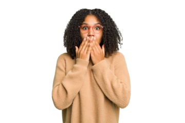 Young african american woman isolated shocked, covering mouth with hands, anxious to discover something new.