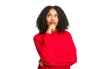 Young african american woman isolated relaxed thinking about something looking at a copy space. - Powered by Adobe