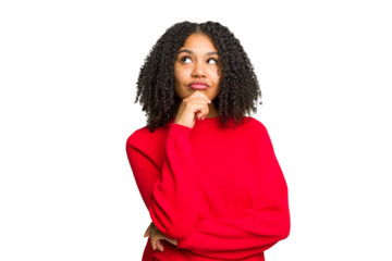 Young african american woman isolated relaxed thinking about something looking at a copy space.