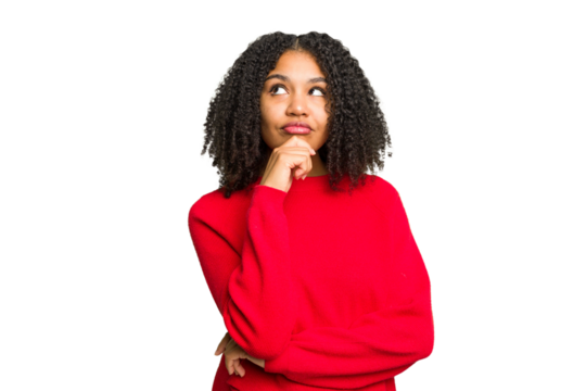 Young african american woman isolated relaxed thinking about something looking at a copy space.