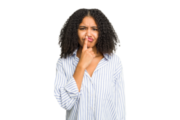 Young african american woman isolated thinking and looking up, being reflective, contemplating, having a fantasy.