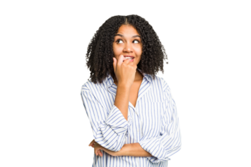 Young african american woman isolated relaxed thinking about something looking at a copy space.