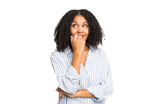 Young african american woman isolated relaxed thinking about something looking at a copy space.