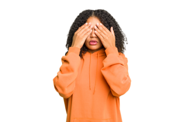 Young african american woman isolated afraid covering eyes with hands.