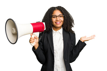 Young african american business woman holding and screaming with a megaphone isolated