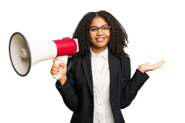 Young african american business woman holding and screaming with a megaphone isolated