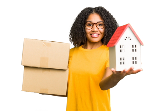 Young african american woman moving to a new home while picking up a box full of things isolated