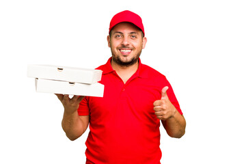 Pizza delivery caucasian man with work uniform picking up pizza boxes isolated smiling and raising thumb up