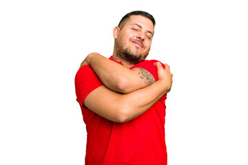 Young caucasian man isolated hugs, smiling carefree and happy.