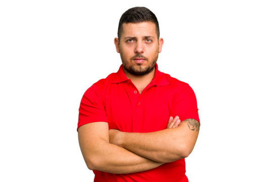 Young caucasian man isolated frowning face in displeasure, keeps arms folded.