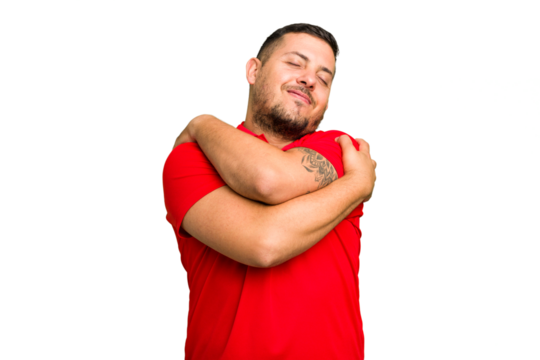 Young caucasian man isolated hugs, smiling carefree and happy.