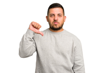 Young caucasian man isolated showing a dislike gesture, thumbs down. Disagreement concept.