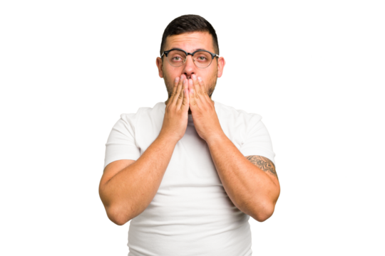 Young caucasian man isolated shocked covering mouth with hands.