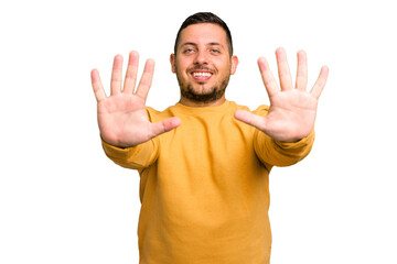 Young caucasian man isolated showing number ten with hands.