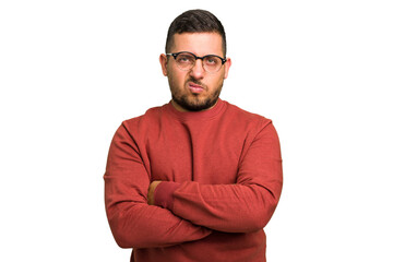 Young caucasian man isolated frowning face in displeasure, keeps arms folded.