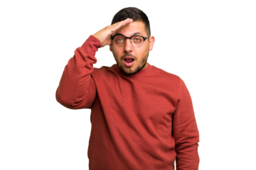 Young caucasian man isolated shouts loud, keeps eyes opened and hands tense.