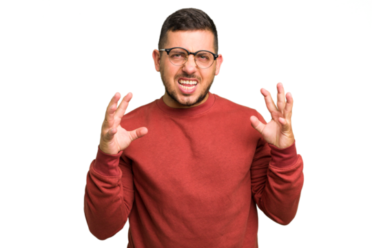 Young caucasian man isolated screaming with rage.