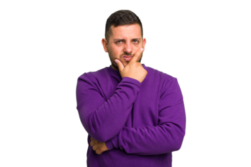 Young caucasian man isolated contemplating, planning a strategy, thinking about the way of a business.