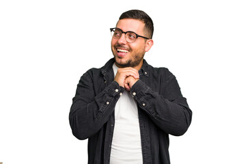 Fototapeta premium Young caucasian man isolated praying for luck, amazed and opening mouth looking to front.