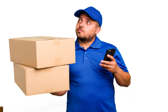 Delivery caucasian man delivering packages and using his mobile phone isolated