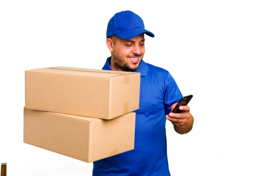 Delivery caucasian man delivering packages and using his mobile phone isolated - Powered by Adobe