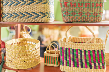 Handmade straw baskets on shelves