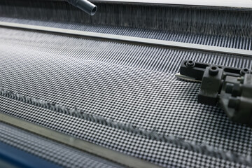 Close-up of an automatic loom without people. Textile Production Line