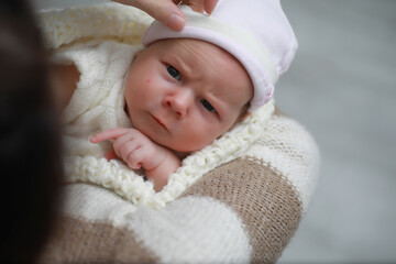 Baby newborn sleeping wrapped up in a blanket