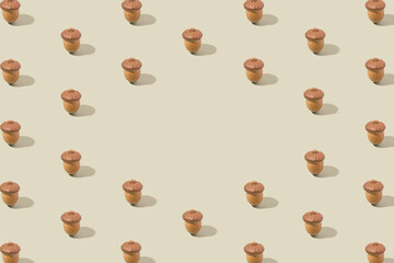 Oak acorns pattern on a pastel green background. Forest, nature creative copy space concept.