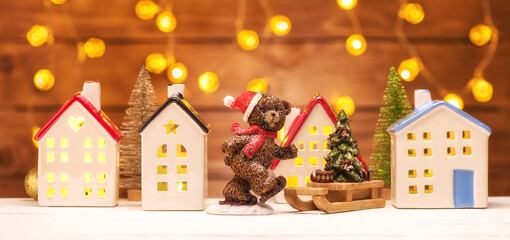 Christmas banner teddy bear and fairy houses with garland lights