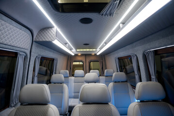 Fototapeta premium comfortable passenger bus interior with upholstered seats 