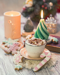 Christmas Candle. New Year's composition with candle in the shape of a Christmas tree. Burning wax candle in shape of fir tree with.