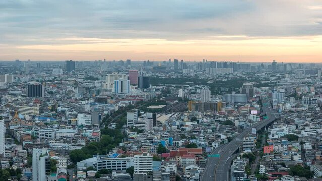 Bangkok city skyline night to day timelapse at city center and street highway, Thailand 4K time lapse