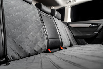 fabric seat cover in a car in a black interior