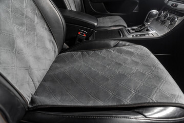 fabric seat cover in a car in a black interior