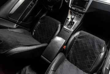 fabric seat cover in a car in a black interior