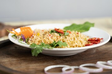 Closeup shot of a plate with delicious cooked white rice and groceries